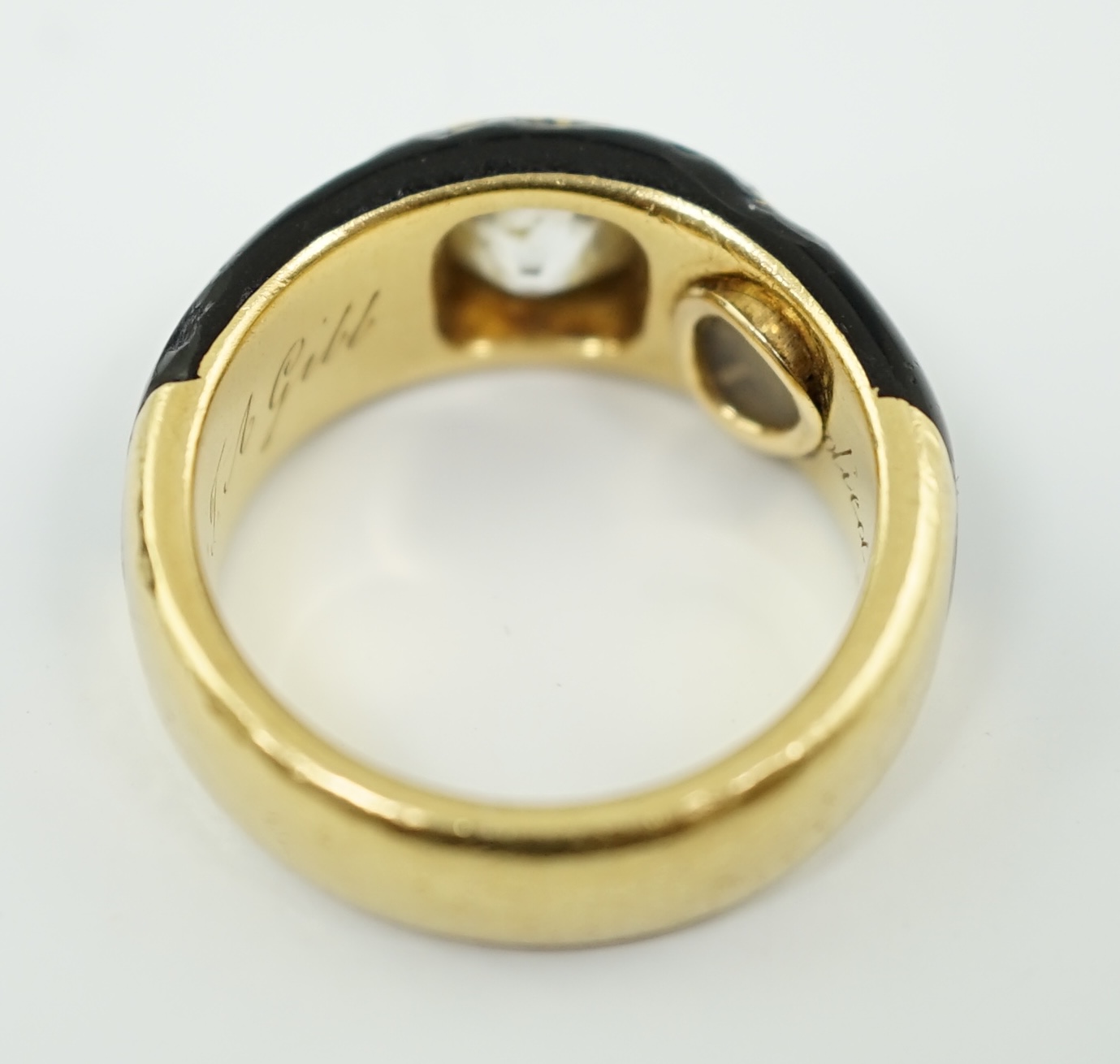 A Victorian gold, black enamel and old mine cut solitaire diamond set mourning ring